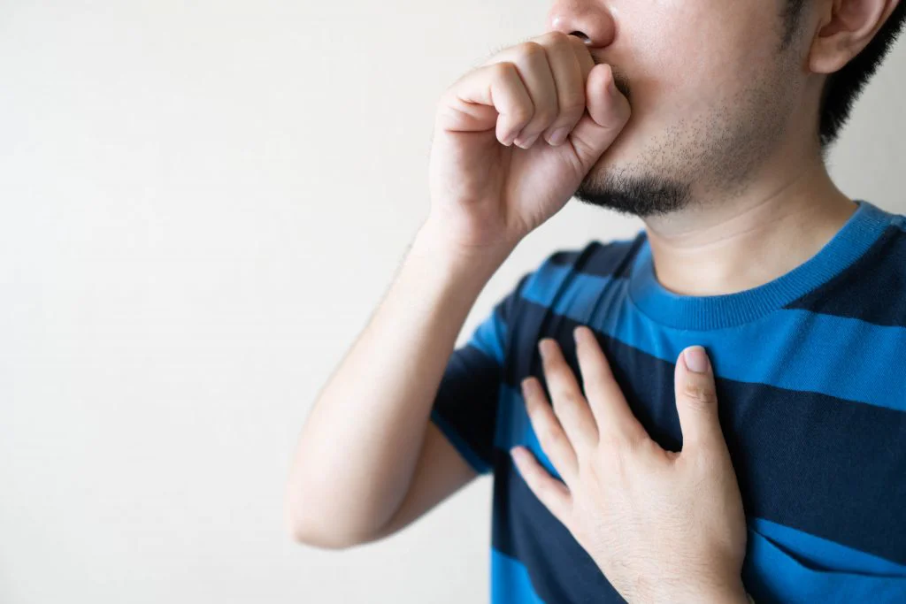Young Man Coughing